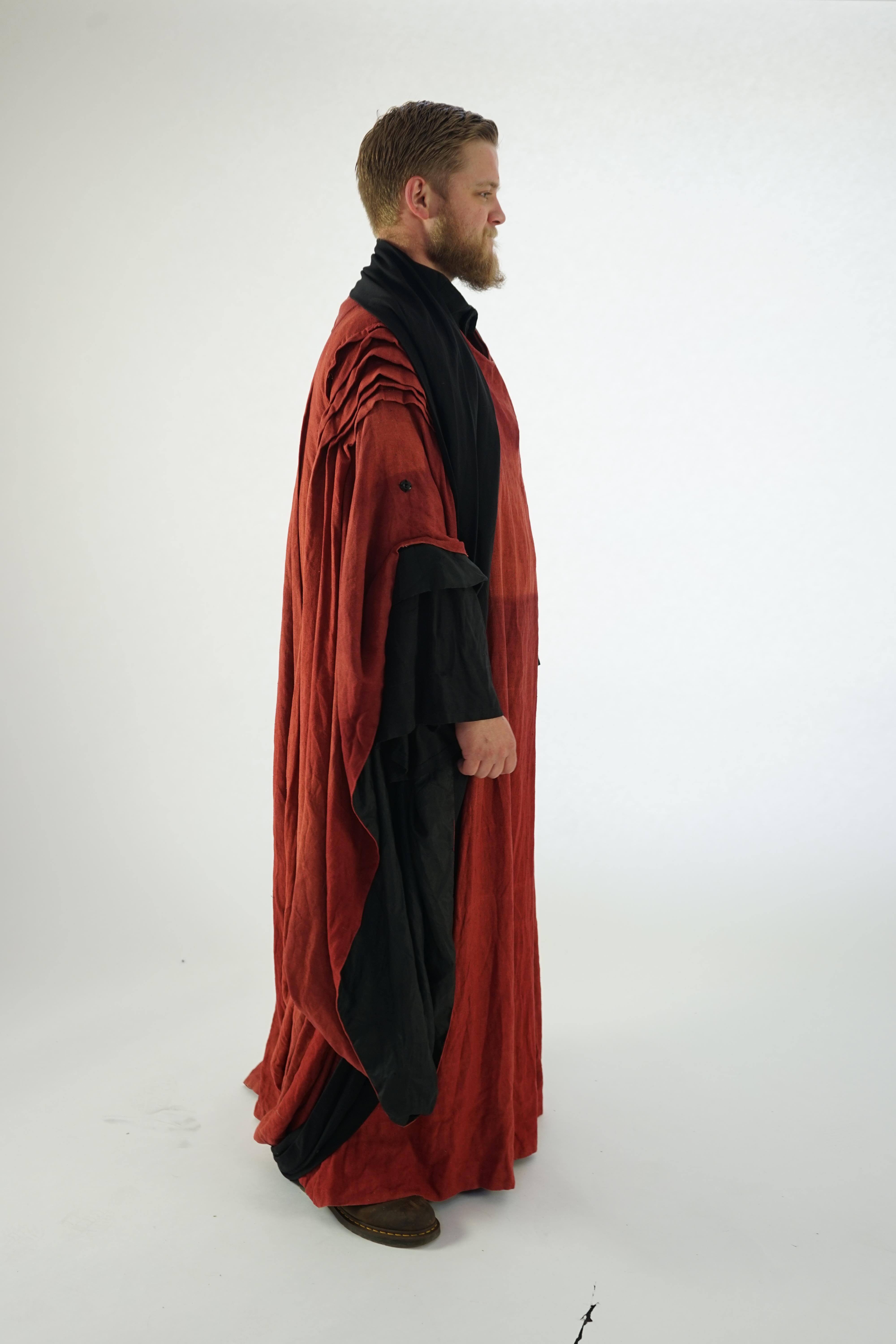 A Priest's inner and outer robe and large belt (rust coloured and black). Ex Glyndebourne Festival Opera 'Idomeneo'